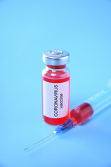 Coronavirus vaccine shot Covid 19 for baby vaccination on blue background, medicine and drug concept