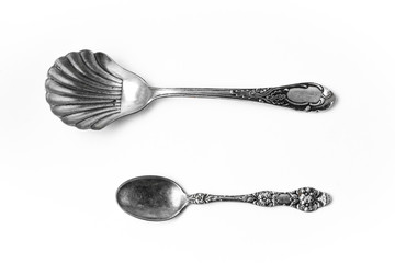 Old silver spoons isolated over white background