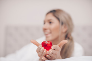 woman with red heart