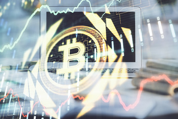 Multi exposure of blockchain and crypto economy theme hologram and table with computer background....