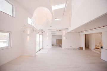 Interior of empty stylish modern open space two level apartment