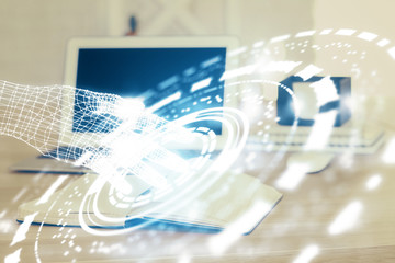 Double exposure of laptop computer and technology theme hologram. Concept of freelance work.