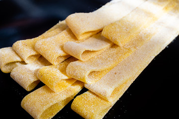 Close up of hand made Italian tagliatelle fresh pasta