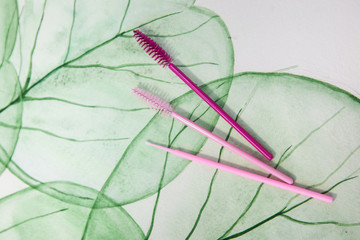  tools for eyelash extensions on a background with a natural pattern