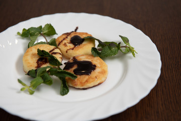pancakes with chocolate sauce and mint