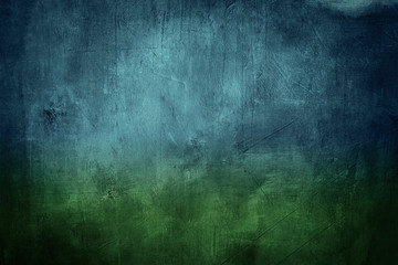 blue and green grunge background or texture with dark vignette borders