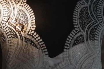 Beautiful wedding golden rings on dark background
