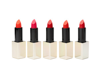 Obraz premium Set of lipstick isolated on white background. Red, Pink and Orange color in various toned.
