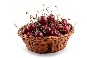 Cherries on wicker plate