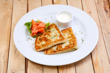 stuffed pancake with cheese and salmon
