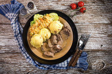 Braised pork tongues in horseradish sauce.