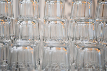 Crystal clear empty wine glasses on the table. Alcohol background. A lot of wine glasses at the bar.background with glass glasses