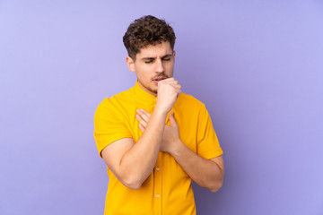 Caucasian man isolated on purple background coughing a lot