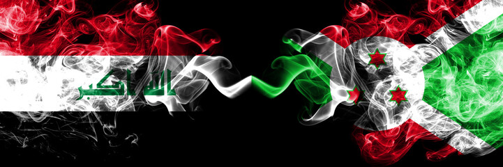 Iraq, Iraqi vs Burundi, Burundian smoky mystic flags placed side by side. Thick colored silky smokes flags together.