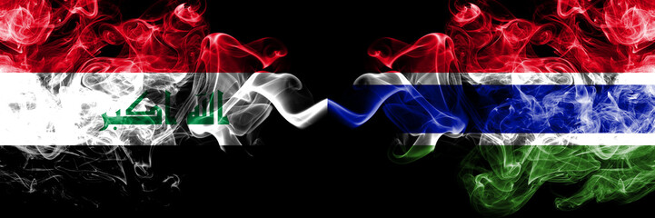 Iraq, Iraqi vs Gambia, Gambian smoky mystic flags placed side by side. Thick colored silky smokes...