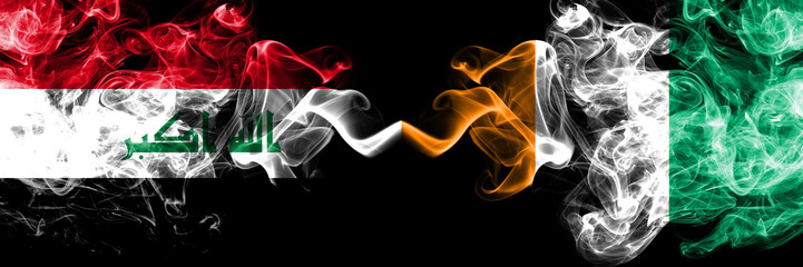Iraq, Iraqi vs Ivory Coast smoky mystic flags placed side by side. Thick colored silky smokes flags together.