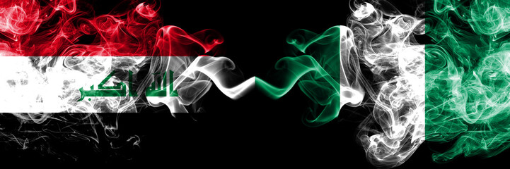 Iraq, Iraqi vs Nigeria, Nigerian smoky mystic flags placed side by side. Thick colored silky smokes flags together.