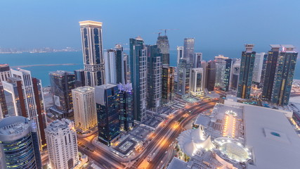 The skyline of the West Bay area from top in Doha day to night timelapse, Qatar.