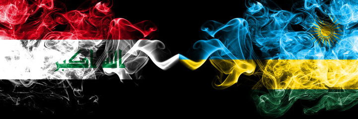 Iraq, Iraqi vs Rwanda, Rwandan smoky mystic flags placed side by side. Thick colored silky smokes...