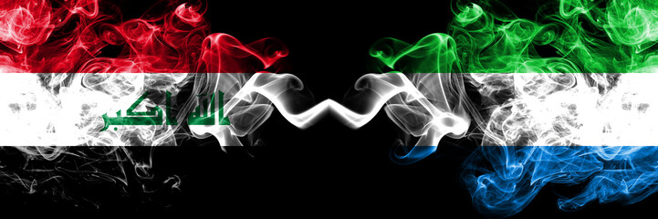 Iraq, Iraqi vs Sierra Leone smoky mystic flags placed side by side. Thick colored silky smokes flags together.