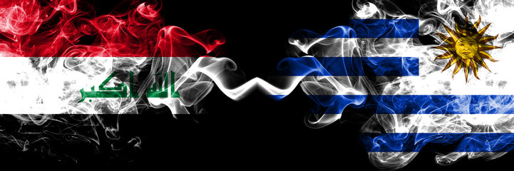 Iraq, Iraqi vs Uruguay, Uruguayan smoky mystic flags placed side by side. Thick colored silky smokes flags together.