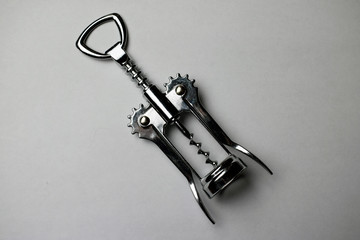 corkscrew with cork on black background