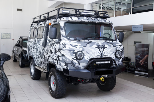 Gray used UAZ car with front view painted in gray raptor line-x paintprepared for off road drive