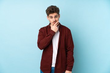 Young caucasian man isolated background thinking