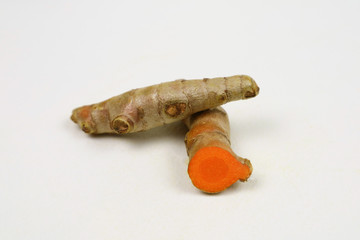  turmeric root  curcumin , isolated on a white background, is an ingredient in turmeric foods. Turmeric helps maintain healthy skin. Turmeric