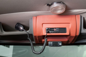 Mobile walkie-talkie on the ceiling of a truck with a microphone and a radio station for...