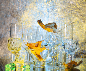 Glassware on abstract diffuse background in yellow blue tones