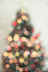 Obraz na płótnie Canvas Bokeh christmas tree background with snowfall