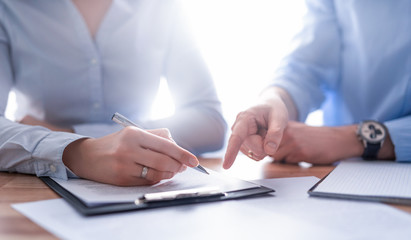 Business people negotiating a contract.