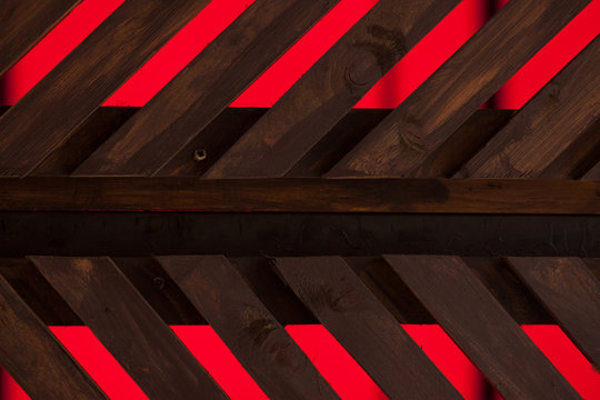 Background and texture wooden brown parallel boards on red background