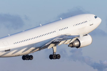 White airplane take off close up view.