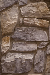 background and texture of brown stone wall
