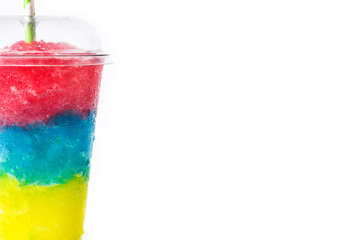 Colorful slushie of differents flavors with straw in plastic cup isolated on white background. Copy space