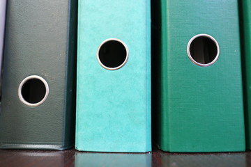 green office folders on the table