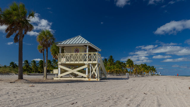 Lifeguard tower near the Palm trees on the Key Biscayne Beach in Florida