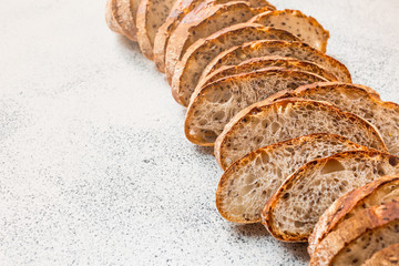 .Sliced ​​bread on a light background. Homemade bread made from natural ingredients without yeast