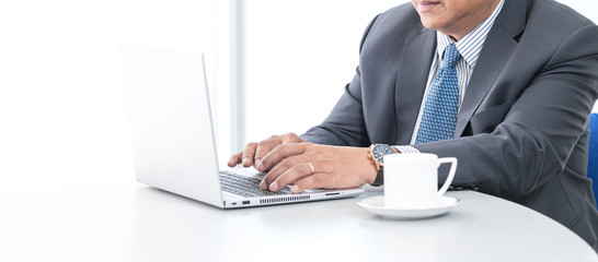 Man hands using laptop in office. professional businessman in suit working on new business project with notebook computer