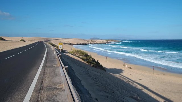 The FV-1 Coast Road going through Parque Natural de Corralejo Sand Dunes