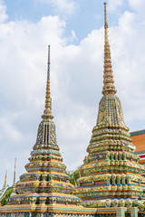 Fototapeta premium The cement pagoda on the outside is decorated with glaze of ceramics. Inside the phra chetuphon wimon mangkararam temple or Thai people call Wat Pho Bangkok, Thailand.
