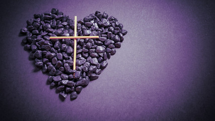 Lent Season,Holy Week and Good Friday concepts - photo of wooden cross and stones in purple vintage...