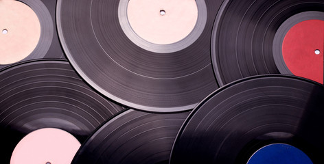 texture of musical vinyl records in black closeup.