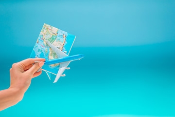 Closeup of map and model airplane background the sea
