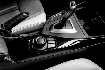 The ideal surface of plastic in the interior of the car is black after polishing and cleaning with car chemistry. Black and white photo