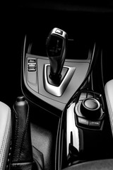 The ideal surface of plastic in the interior of the car is black after polishing and cleaning with car chemistry. Black and white photo