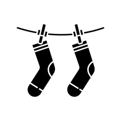 Outside drying black glyph icon. Laundry, clothesline, outdoors clothes drying. Socks hanging on clothesline, washed garment. Silhouette symbol on white space. Vector isolated illustration