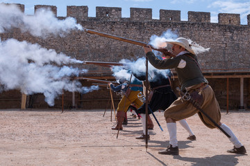 PortraGroup of musketeers in the palenque of a castle, doing shooting practicesit of a Spanish...